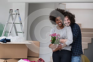 Multiethnic couple moving into a new home