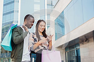 Multiethnic couple shopping together