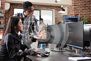 Multiethnic cyber security team developing software algorithm for information processing