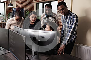 Multiethnic cyber security team developing software algorithm for information processing