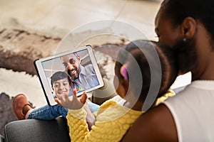 Multiethnic family doing video call using digital tablet