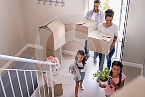 Multiethnic family moving in new home