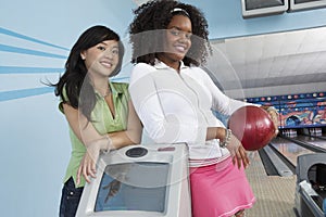 Multiethnic Female Friends At Bowling Alley