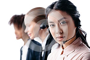 multiethnic female operators working with headset