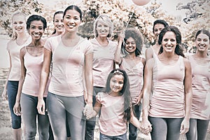 Multiethnic females supporting breast cancer awareness