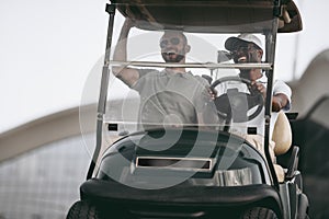 Multiethnic friends having fun while driving golf cart