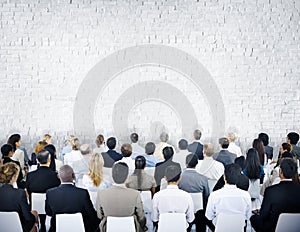 Multiethnic Group of Audiences with Brick Wall photo