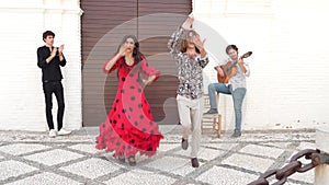 Multiethnic group of flamenco dancers dancing for tourists in San Nicolas. Albaicin.