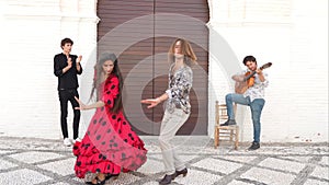 Multiethnic group of flamenco dancers dancing for tourists in San Nicolas. Albaicin.