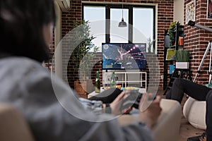 Multiethnic group of people playing online video games on tv console