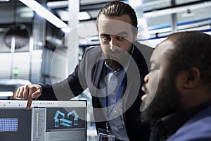 Multiethnic group of solar energy experts and technicians evaluates system