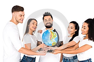multiethnic group of young people holding globe isolated