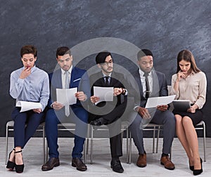 Multiethnic job candidates preparing for job interview