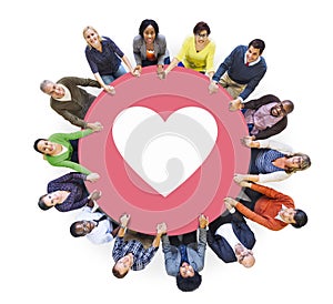 Multiethnic People Holding Hands with Heart Symbol