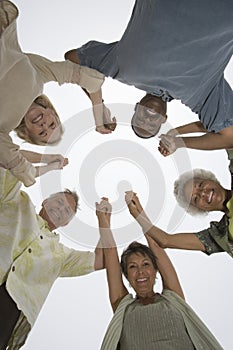 Multiethnic People Holding Hands In A Huddle photo