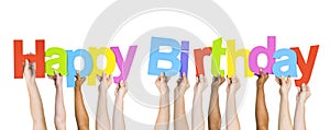 Multiethnic People Holding The Word Happy Birthday