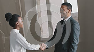 Multiethnic people make profit deal shake hands thanking for help or advice finish successful business negotiations in