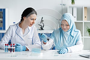 Multiethnic scientists in medical masks working