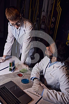 multiethnic scientists working near test tubes