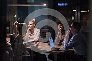 Multiethnic startup business team in night office