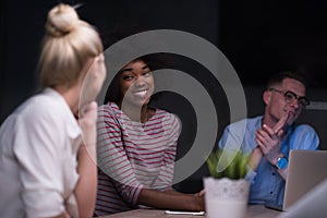 Multiethnic startup business team in night office