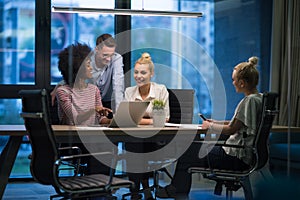 Multiethnic startup business team in night office