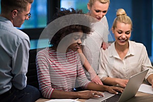 Multiethnic startup business team in night office