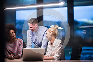 Multiethnic startup business team in night office