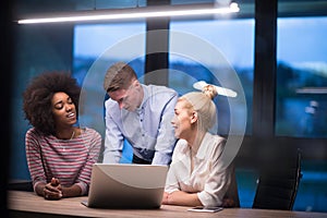 Multiethnic startup business team in night office