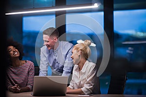 Multiethnic startup business team in night office