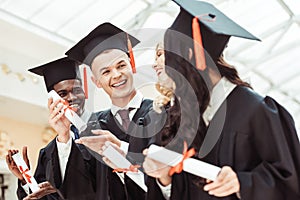 laughing graduated multiethnic students