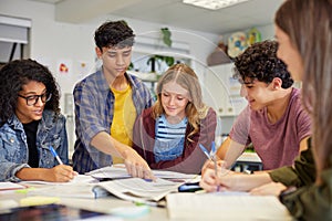 Multiethnic students studying together at secondary school