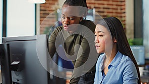 Multiethnic team of IT developers working on computers