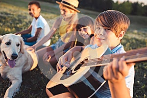 Multiethnic teenagers with guitar