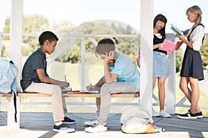 Multiethnic teenagers studying together