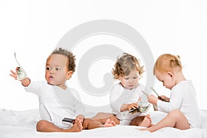 group of multiethnic toddlers holding cash and credit cards photo