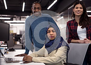 Multiethnics team of software developers working together