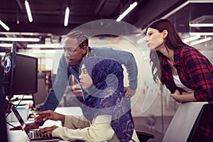 Multiethnics team of software developers working together