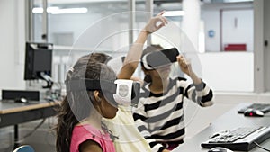 Multietnic children wearing virtual reality glasses.