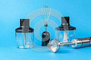 Multifunctional hand blender on a blue background