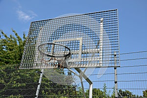 Multifunctional outdoor playground for ball games at school. green artificial turf from a plastic carpet with lines. basketball ho