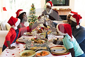 Multigeneration family having christmas dinner together