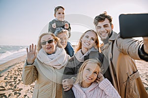 multigenerational family taking selfie on smartphone