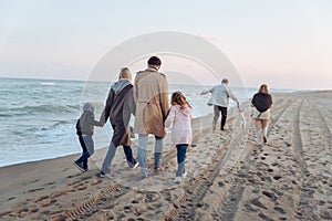 multigenerational family walking with dog