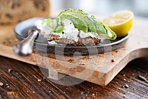 Multigrain bread with cream cheese and avocado