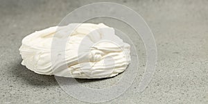 Multilayered meringue dessert on a light background, Long banner format