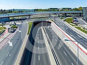 Multilevel city highway junction crossroad with viaducts, tunnel and rotary