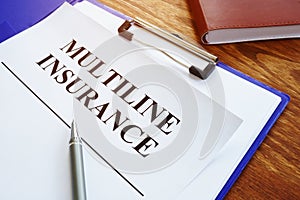 Multiline Insurance agreement and pile of papers