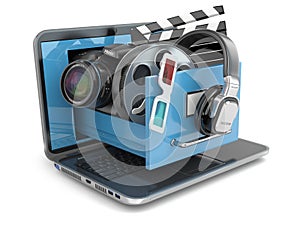 Multimedia concept. Laptop, camera , headphones and video attributes.