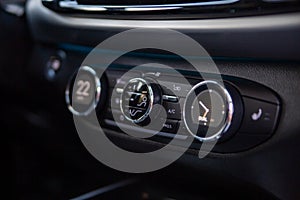 multimedia control console and climate in a modern car. close-up, selective focus, no people